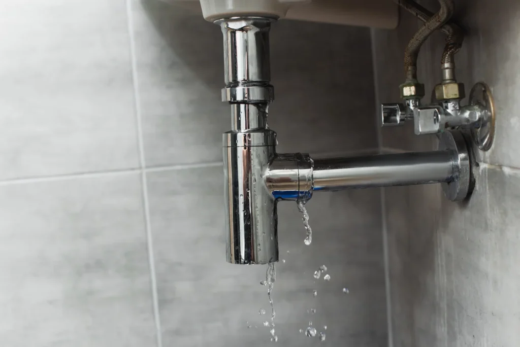 A leaking bathroom sink pipe
