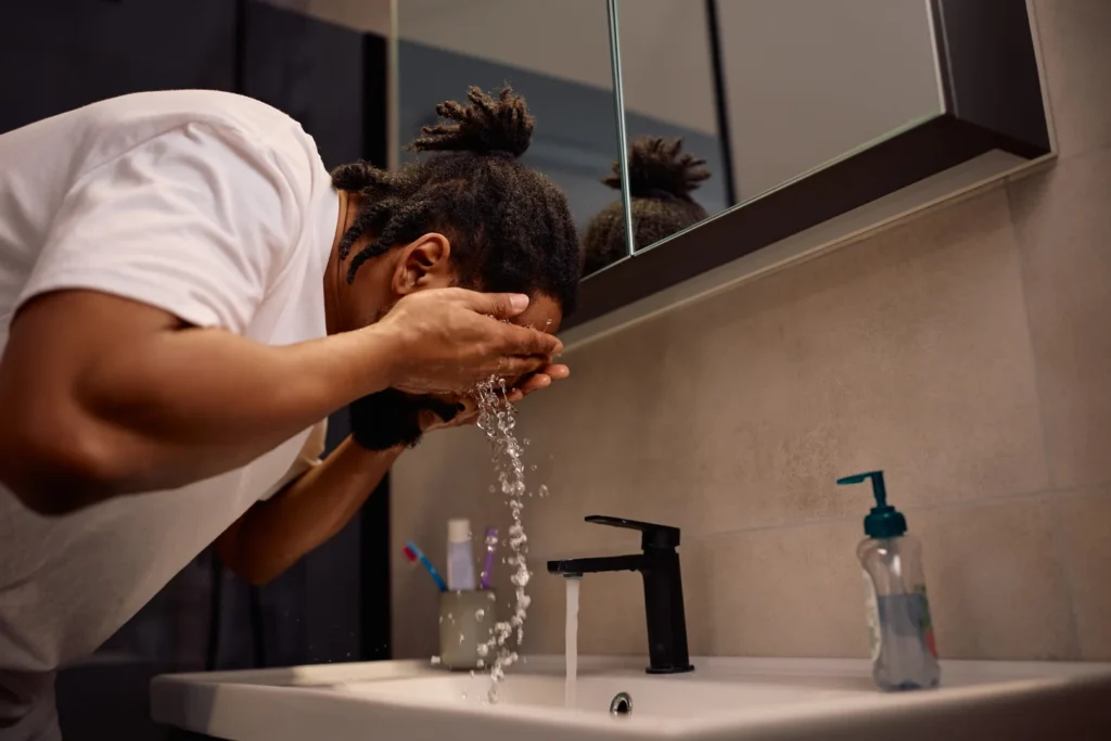 A man washing his face